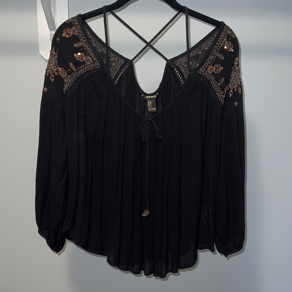 Women’s top with fun straps and rose gold beadwork and detailing